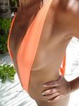My small breasts in an orange sling bikini